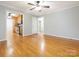 Hardwood floor living room, open to kitchen and hallway at 1511 Anthony Dr, Gastonia, NC 28052