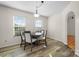 Dining area features wood flooring and a four-person table at 1518 Indian Springs Nw Dr, Conover, NC 28613