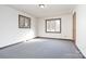 Simple bedroom with neutral walls, carpet flooring, and two windows at 155 Quail Dr, Salisbury, NC 28147