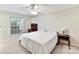 Bright bedroom with a queen-size bed and large window at 1708 Roxborough Rd # E, Charlotte, NC 28211