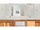 Double vanity bathroom with a large mirror and wood cabinets at 1805 Lexington Ave, Monroe, NC 28112