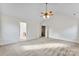 Large bedroom with carpet, ceiling fan, and access to bathroom at 1805 Lexington Ave, Monroe, NC 28112