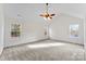 Spacious bedroom with carpeted floors and a ceiling fan at 1805 Lexington Ave, Monroe, NC 28112
