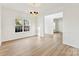 Spacious dining room with hardwood floors and chandelier at 1805 Lexington Ave, Monroe, NC 28112