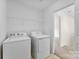 Laundry room with washer, dryer and shelving at 1805 Lexington Ave, Monroe, NC 28112