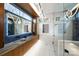 Modern bathroom with double vanity, glass shower, and blue tile at 1823 Bentley Pl, Charlotte, NC 28205