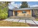 Modern front porch with concrete steps, wood siding, and black metal chairs at 1823 Bentley Pl, Charlotte, NC 28205