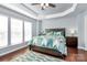 Bright bedroom with wood floors and ceiling fan at 2448 Kensington Station Pkwy, Charlotte, NC 28210