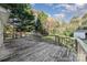 Large wooden deck overlooks backyard with spacious green space at 307 E 2Nd St, Lowell, NC 28098