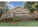 House with deck and spacious backyard with green grass at 307 E 2Nd St, Lowell, NC 28098