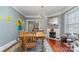 Bright dining area with hardwood floors and fireplace at 307 E 2Nd St, Lowell, NC 28098