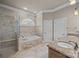 Large bathroom with double sinks, soaking tub, and walk-in shower at 3416 Maryhurst Ln, Charlotte, NC 28226