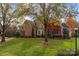 Two-story brick home with mature trees and landscaping at 3416 Maryhurst Ln, Charlotte, NC 28226