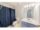 Bathroom with shower, toilet, and a blue vanity at 3507 Summerfield Ridge Ln, Matthews, NC 28105