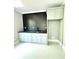 Basement bar with gray cabinets and black tile backsplash at 3535 Katrina Ave, Concord, NC 28025