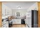 White kitchen with stainless steel appliances and granite countertops at 4477 Pinebrook Dr, Rock Hill, SC 29730