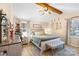 Main bedroom with wood beams, cozy sitting area, and a calming color scheme at 4477 Pinebrook Dr, Rock Hill, SC 29730