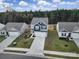Two-story house with gray and blue exterior, two-car garage, and landscaped yard at 654 Lancelot Dr, Richburg, SC 29729