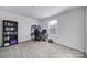 Bright bedroom with carpeted floor, built-in shelving and workspace at 654 Lancelot Dr, Richburg, SC 29729