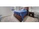Cozy bedroom with dark wood furniture and blue bedding at 654 Lancelot Dr, Richburg, SC 29729
