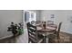 Dining area with wood table and chairs, near sliding door at 654 Lancelot Dr, Richburg, SC 29729