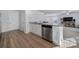 Modern kitchen with granite countertops and stainless steel appliances at 654 Lancelot Dr, Richburg, SC 29729