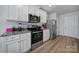 Well-equipped kitchen featuring white cabinets and granite countertops at 654 Lancelot Dr, Richburg, SC 29729