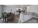 Modern kitchen with granite countertops and white cabinets at 654 Lancelot Dr, Richburg, SC 29729