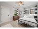 Bright bedroom with metal bed frame and wood dresser at 7313 Mockingbird Ln, Waxhaw, NC 28173