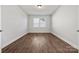 Bright bedroom with wood-look floors and neutral walls at 8360 Acadia Pkwy # 017, Sherrills Ford, NC 28673