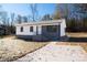 Newly built home with gray and white exterior, landscaping, and driveway at 1003 N Cansler St, Kings Mountain, NC 28086