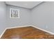 Spacious bedroom with gray walls and hardwood floors at 1203 Northwoods Dr, Kings Mountain, NC 28086