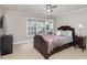 Cozy bedroom with a queen bed and built-in shelving at 121 Quality Dr, Mount Holly, NC 28120