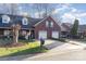 Brick front of townhome with 2-car garage and neatly landscaped yard at 121 Quality Dr, Mount Holly, NC 28120