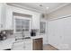 Modern kitchen with white cabinets, double sink, and stainless steel appliances at 121 Quality Dr, Mount Holly, NC 28120