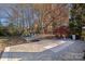 Expansive backyard with fire pit and wooded area at 12128 Robins Nest Ln, Charlotte, NC 28269
