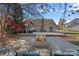 Large brick patio with fire pit, perfect for outdoor entertaining at 12128 Robins Nest Ln, Charlotte, NC 28269