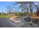 Spacious backyard patio with fire pit and seating area at 12128 Robins Nest Ln, Charlotte, NC 28269