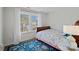 Small bedroom with a twin-size bed and ample natural light at 12128 Robins Nest Ln, Charlotte, NC 28269