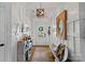Welcoming entryway with a bench and large mirror at 12128 Robins Nest Ln, Charlotte, NC 28269