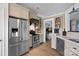 Kitchen features stainless steel appliances and light wood cabinets at 12128 Robins Nest Ln, Charlotte, NC 28269