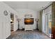 Cozy living room featuring a large TV and access to the backyard at 12128 Robins Nest Ln, Charlotte, NC 28269