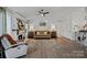 Spacious living room with a fireplace and comfortable seating at 12128 Robins Nest Ln, Charlotte, NC 28269