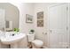 Clean powder room with pedestal sink and decorative wall art at 1414 Kronas Cir, Waxhaw, NC 28173