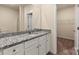 Bathroom with granite countertop, white cabinets, and walk-in closet at 1532 Doran Ter, Richburg, SC 29729