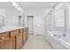 Bathroom with double vanity, soaking tub and shower at 15331 Legend Oaks Ct, Fort Mill, SC 29707
