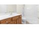 Clean bathroom with a shower/tub combo and wood vanity at 15331 Legend Oaks Ct, Fort Mill, SC 29707