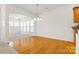 Hardwood floor dining area with a view of the kitchen and living room at 15331 Legend Oaks Ct, Fort Mill, SC 29707
