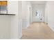 Neutral colored entryway with tile floors and white wainscoting at 15331 Legend Oaks Ct, Fort Mill, SC 29707