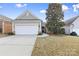 Gray siding ranch home with white garage door and landscaping at 15331 Legend Oaks Ct, Fort Mill, SC 29707